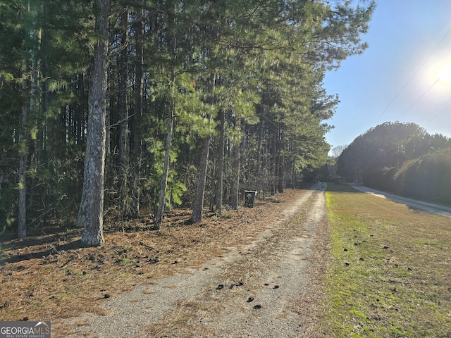 view of road featuring a view of trees