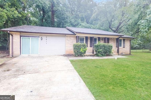 single story home with brick siding, driveway, and a front lawn