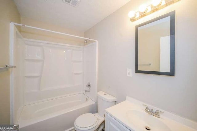 bathroom with visible vents, shower / tub combination, vanity, and toilet