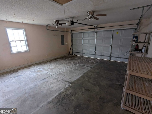 garage featuring electric panel, baseboards, and a garage door opener