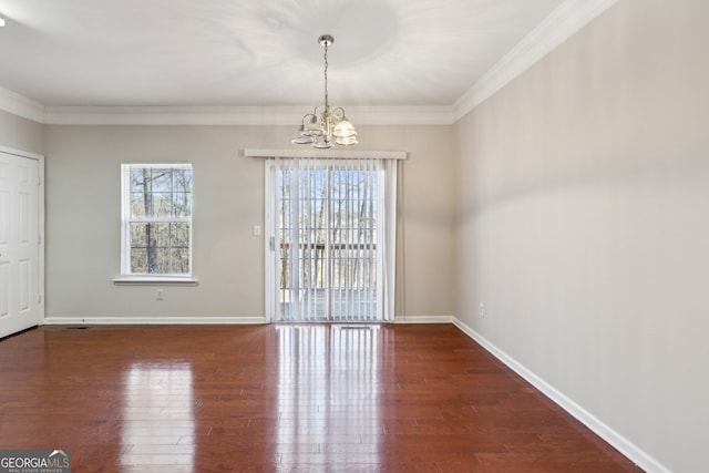 unfurnished dining area with plenty of natural light, a chandelier, and wood-type flooring