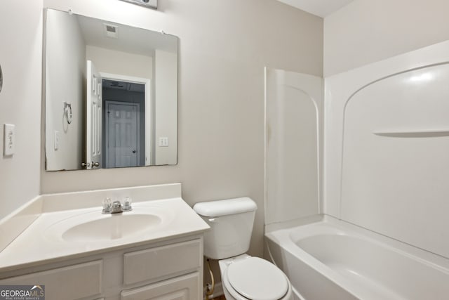 bathroom with toilet, visible vents, bathing tub / shower combination, and vanity