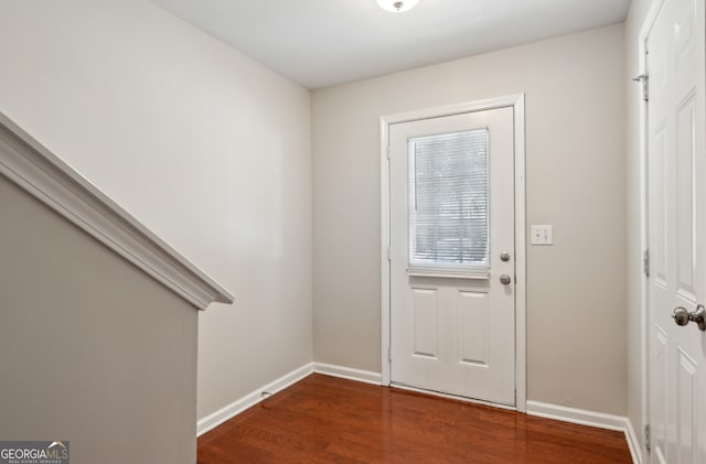 entryway featuring wood finished floors and baseboards