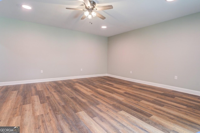 unfurnished room featuring ceiling fan, recessed lighting, wood finished floors, and baseboards