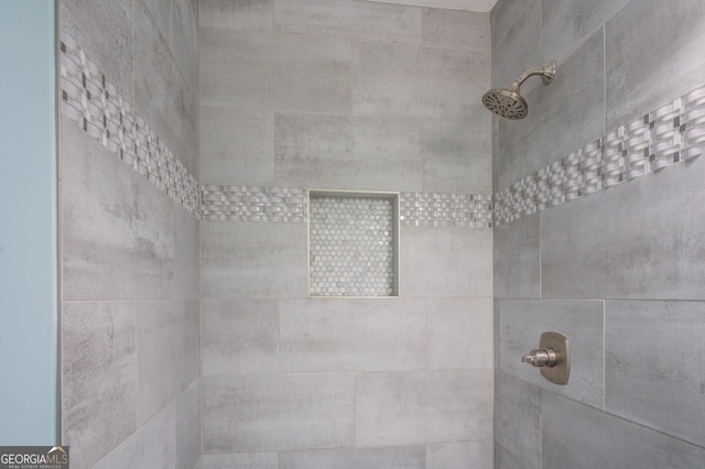 full bathroom with a tile shower