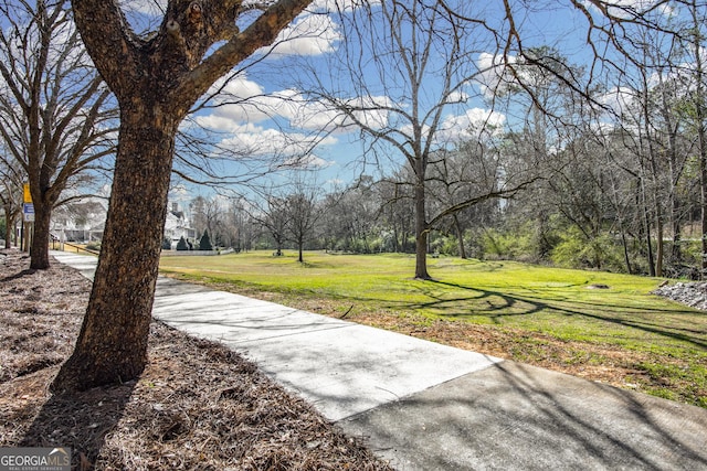 view of home's community with a lawn