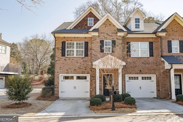 view of front of property featuring concrete driveway, brick siding, and an attached garage