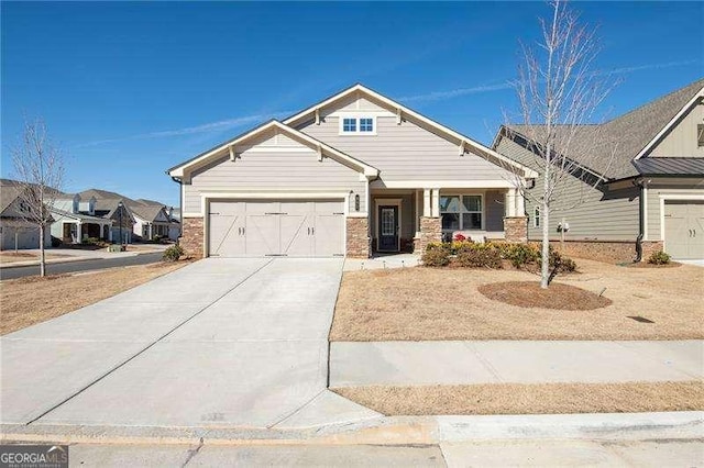 craftsman-style house featuring driveway and brick siding