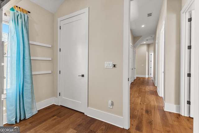 hall featuring recessed lighting, wood finished floors, visible vents, and baseboards