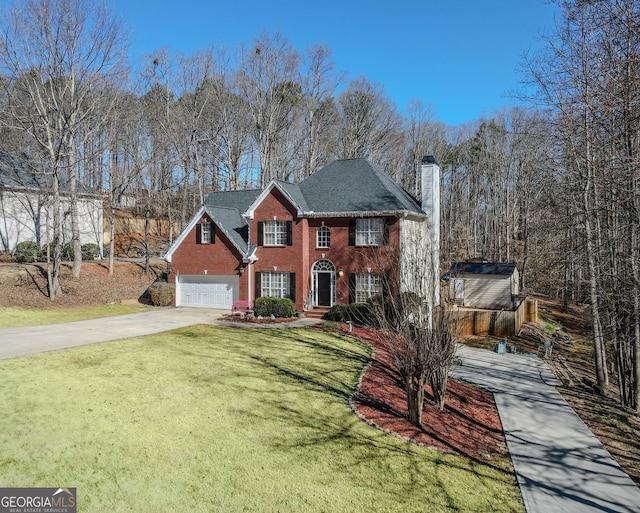 view of front of house featuring concrete driveway, brick siding, a chimney, and a front yard