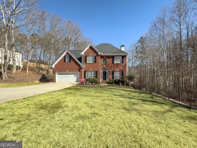 view of front facade with brick siding, a chimney, concrete driveway, a garage, and a front lawn