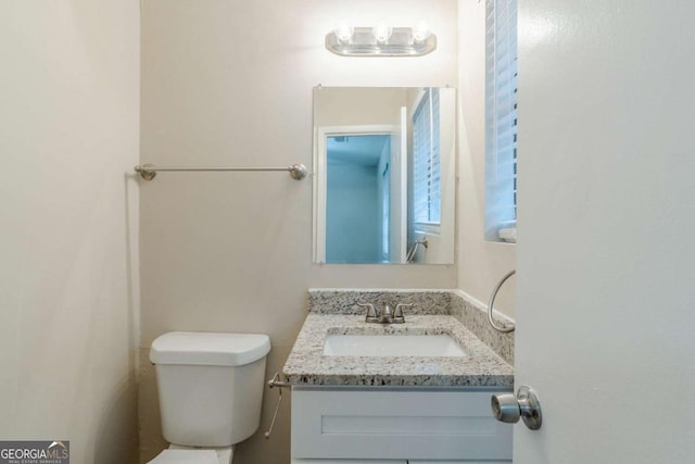 bathroom with vanity and toilet