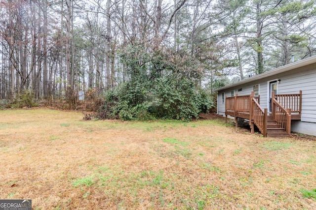 view of yard with a deck