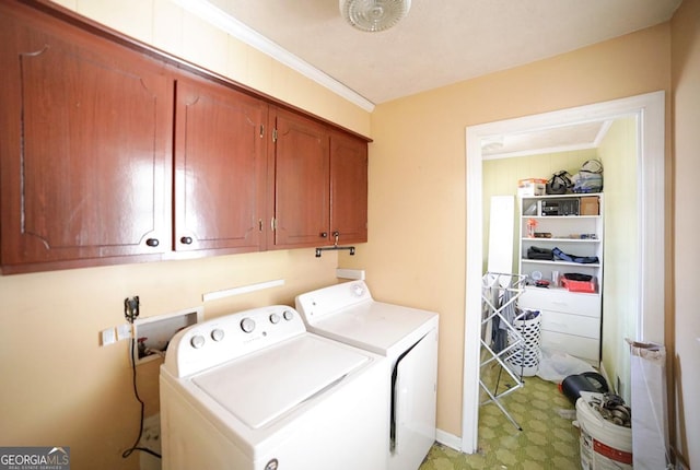 laundry area with crown molding, cabinet space, independent washer and dryer, and light floors