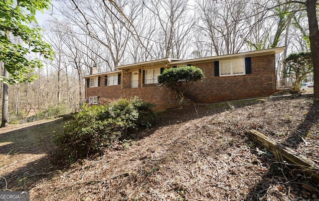 single story home with brick siding