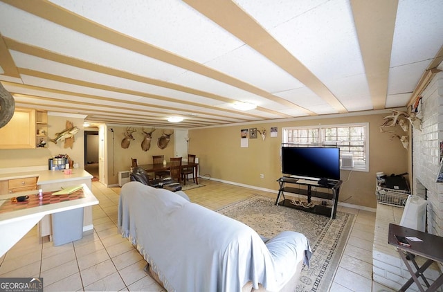 living room with light tile patterned flooring and baseboards