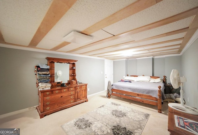 bedroom with carpet floors, crown molding, and baseboards