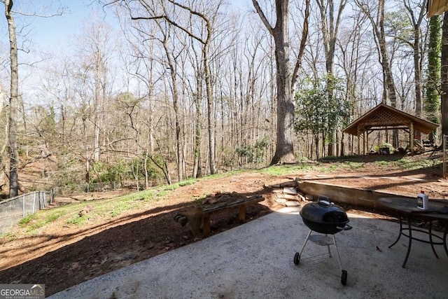 view of yard featuring fence, a gazebo, and a patio