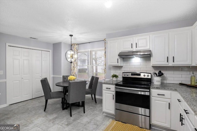 kitchen featuring under cabinet range hood, stainless steel electric stove, white cabinetry, light stone countertops, and tasteful backsplash