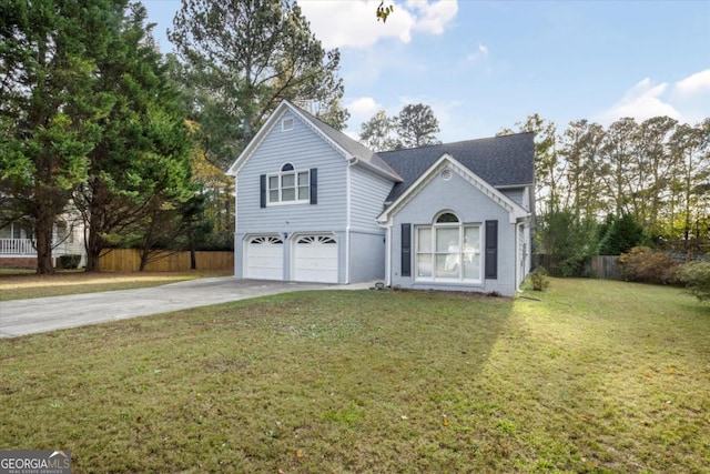 traditional-style home featuring a garage, concrete driveway, fence, a front yard, and brick siding