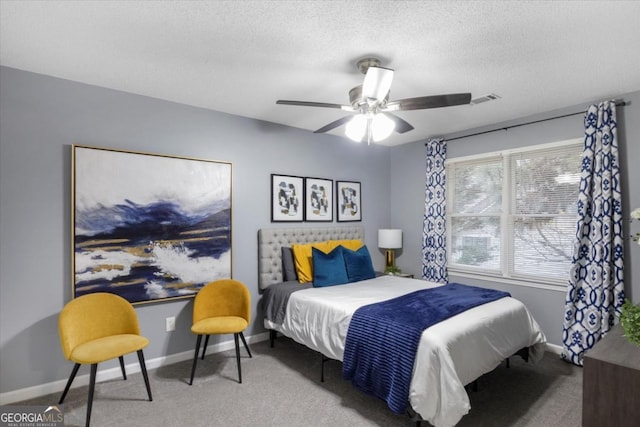 bedroom featuring carpet, visible vents, ceiling fan, a textured ceiling, and baseboards