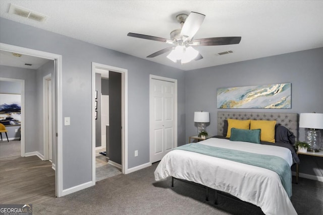 bedroom with visible vents, ceiling fan, baseboards, and ensuite bathroom