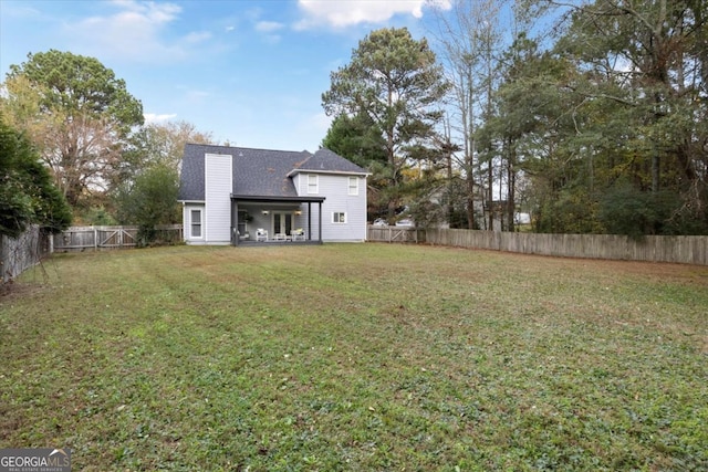 view of yard with a fenced backyard