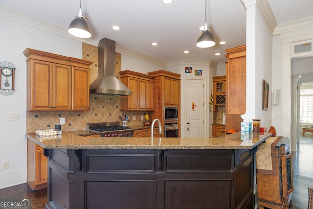 kitchen with tasteful backsplash, wall chimney exhaust hood, oven, light stone countertops, and built in microwave