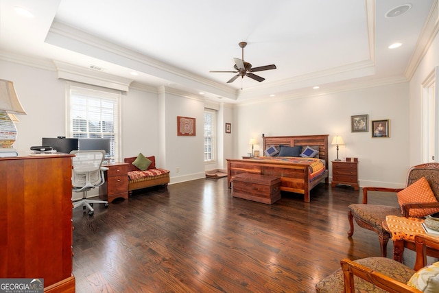 bedroom featuring crown molding, a raised ceiling, and dark wood finished floors