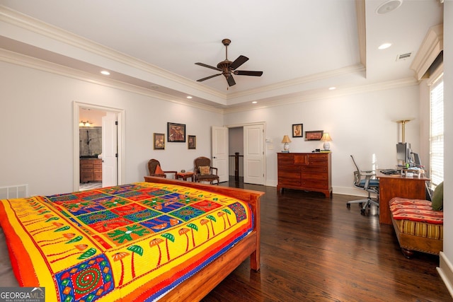 bedroom featuring recessed lighting, a tray ceiling, wood finished floors, and ornamental molding