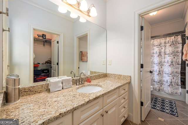 bathroom with shower / bath combo with shower curtain, tile patterned flooring, and vanity