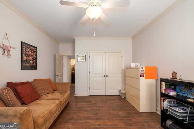 living room featuring a ceiling fan, ornamental molding, and dark wood-style flooring