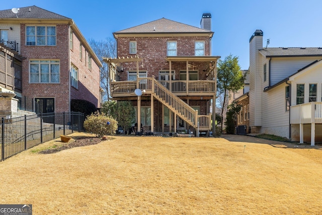 rear view of property with brick siding, central AC, fence, a wooden deck, and stairs