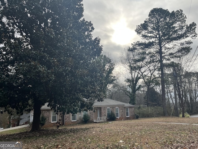 view of front of house with brick siding