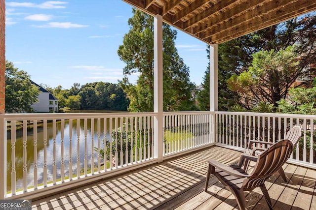 wooden terrace with a water view