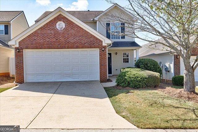 traditional home featuring a garage, concrete driveway, and brick siding