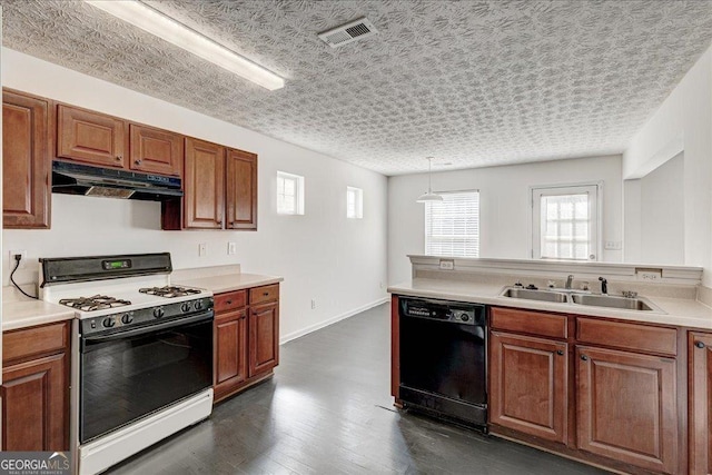 kitchen with white range with gas cooktop, visible vents, dishwasher, under cabinet range hood, and a sink