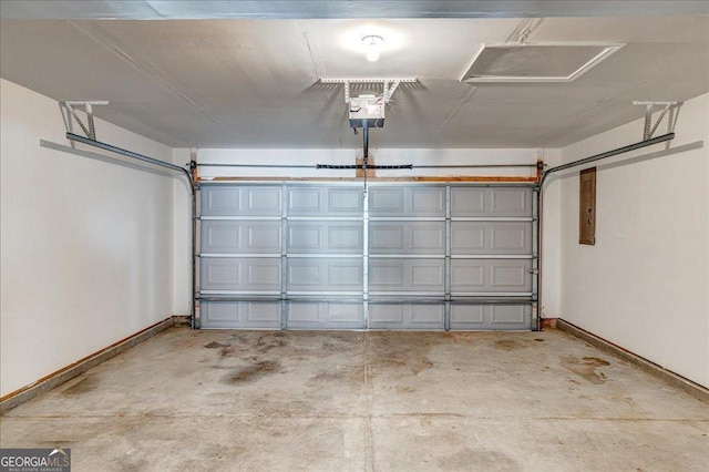 garage with a garage door opener, electric panel, and baseboards