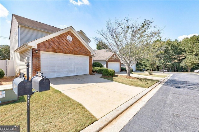 view of front of property featuring brick siding, driveway, and an attached garage