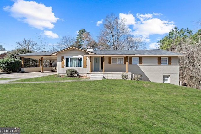 ranch-style house featuring an attached carport, driveway, a chimney, and a front yard