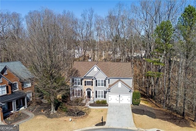 view of front facade featuring driveway and an attached garage