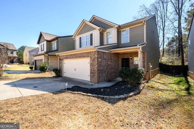 view of front of property with a garage, fence, concrete driveway, and brick siding