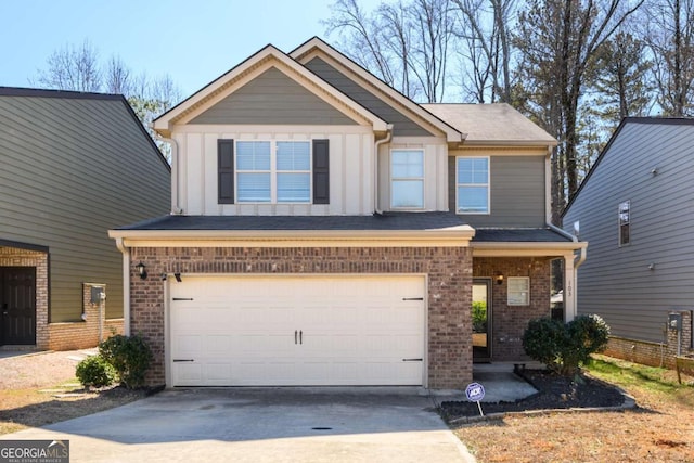 craftsman-style home featuring an attached garage, board and batten siding, concrete driveway, and brick siding