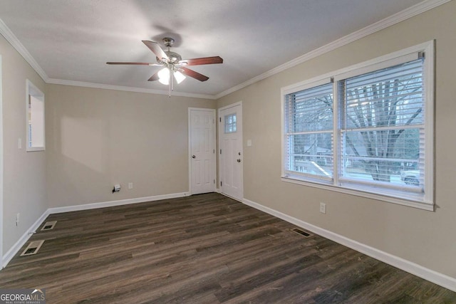 foyer entrance featuring ornamental molding, dark wood-style flooring, baseboards, and a ceiling fan