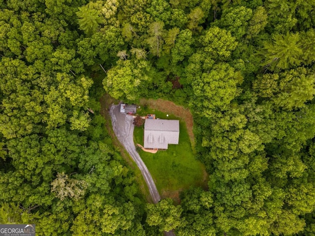 aerial view featuring a view of trees