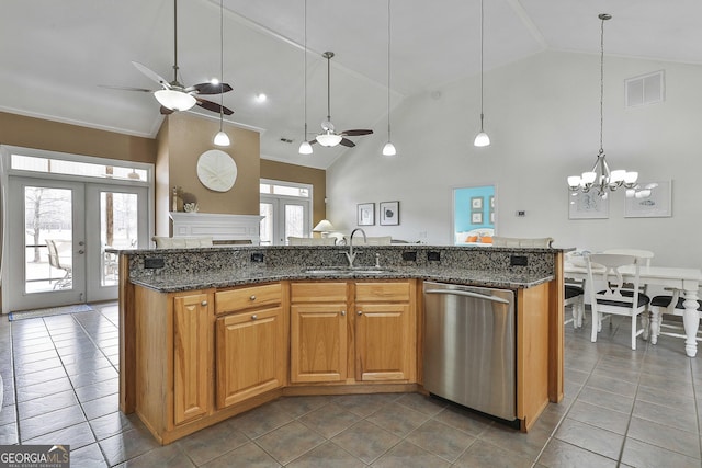 kitchen featuring visible vents, french doors, stainless steel dishwasher, a sink, and ceiling fan with notable chandelier