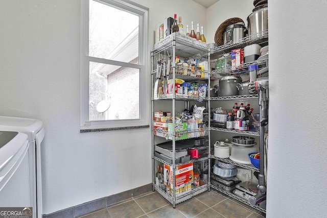 storage area featuring washer and dryer