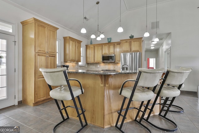 kitchen with light tile patterned floors, appliances with stainless steel finishes, visible vents, and decorative backsplash