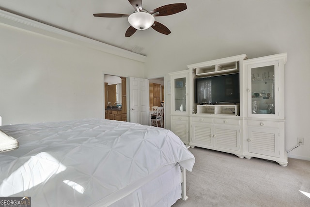 bedroom with light carpet, vaulted ceiling, and ceiling fan