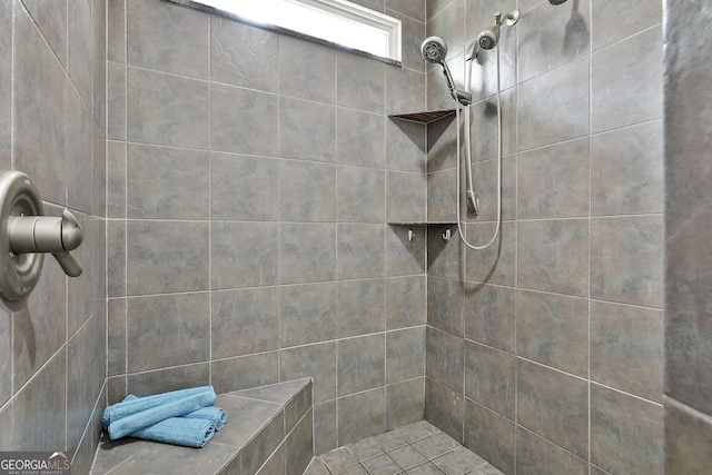 full bath featuring tiled shower